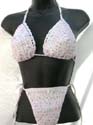 Slide sequined beige halter bikini top matched with bow tie thong. Tie on neck and in back