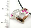Fashion necklace with black thick cord string holding a heart pendant with cut-out mini heart shape on it and cz stone embedded. Lobster clasp